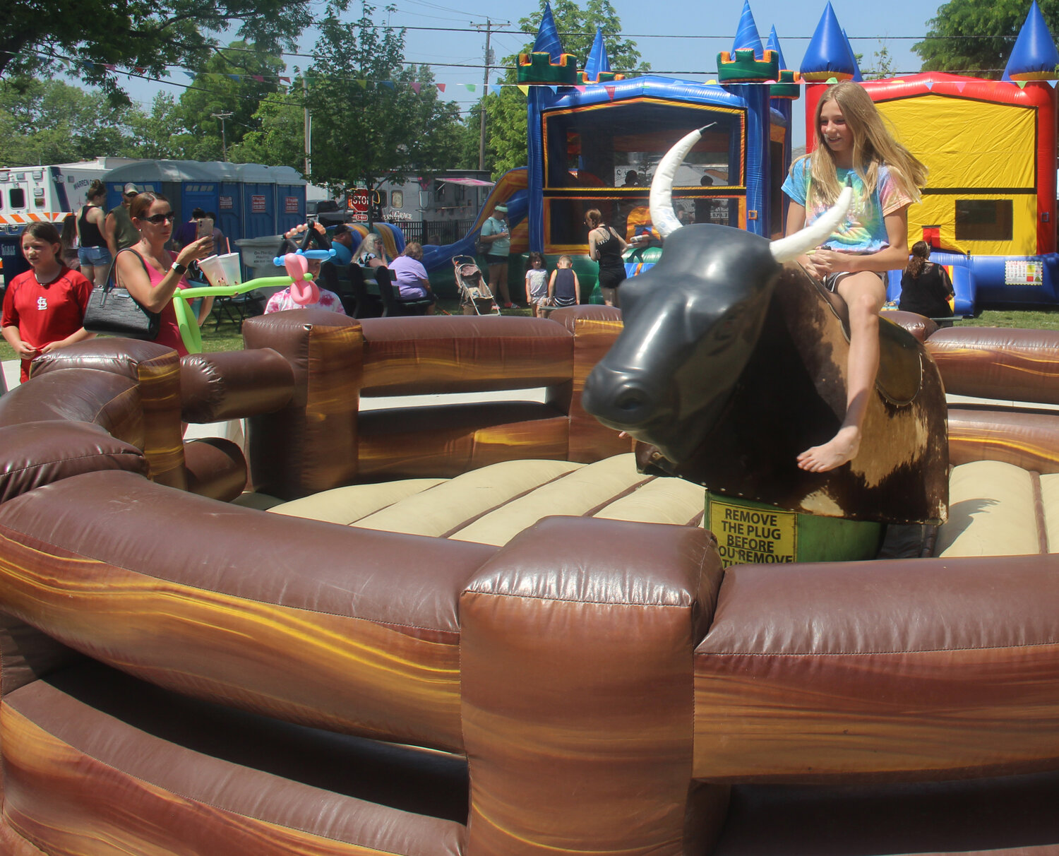 This young girl was one of several kids who tried out the mechanical bull at Summerfest.