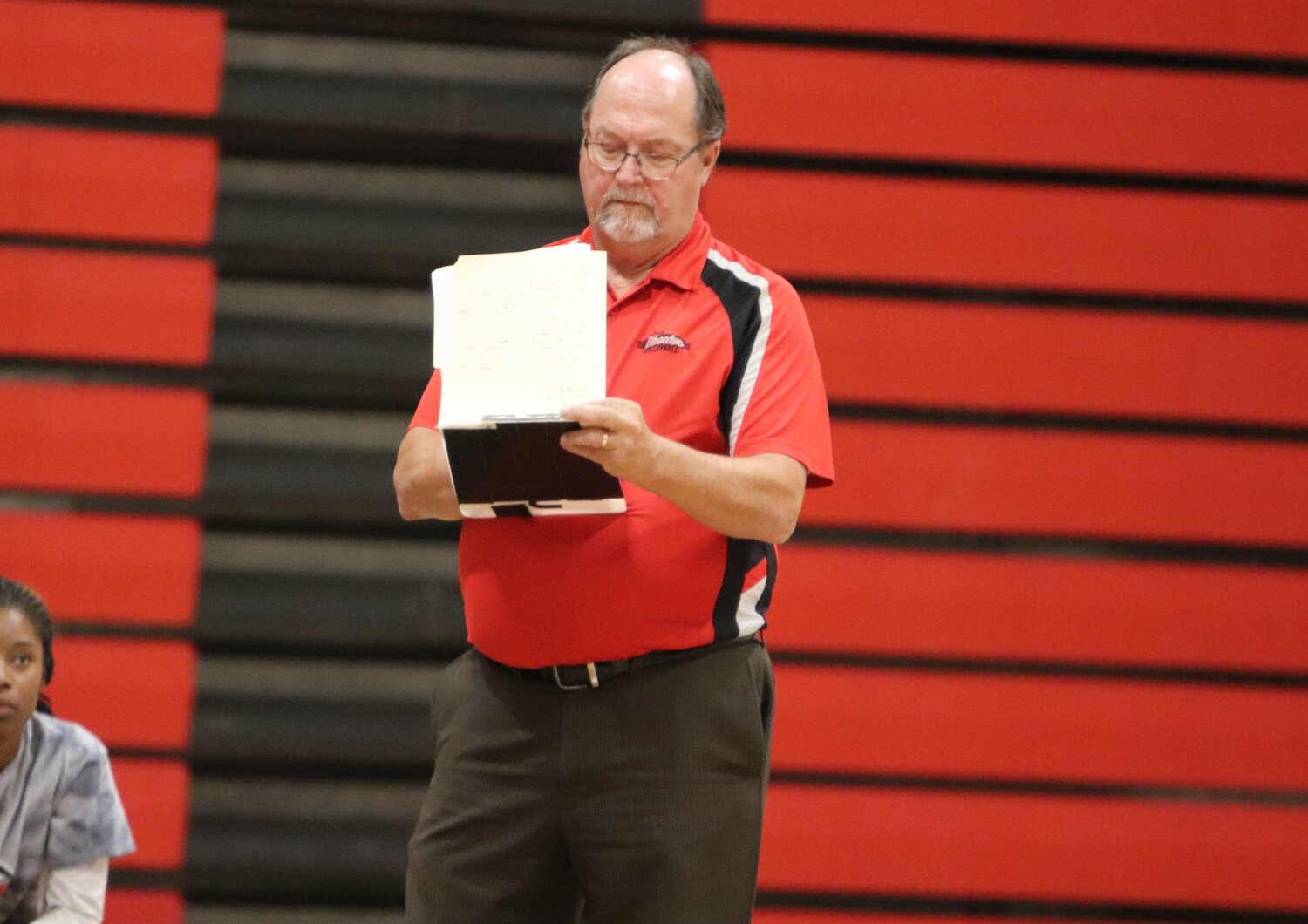 Randy Kindschuh takes a note during a game against St. Charles West this past season. Kindschuh announced he is retiring from his coaching and teaching position at Warrenton High School.