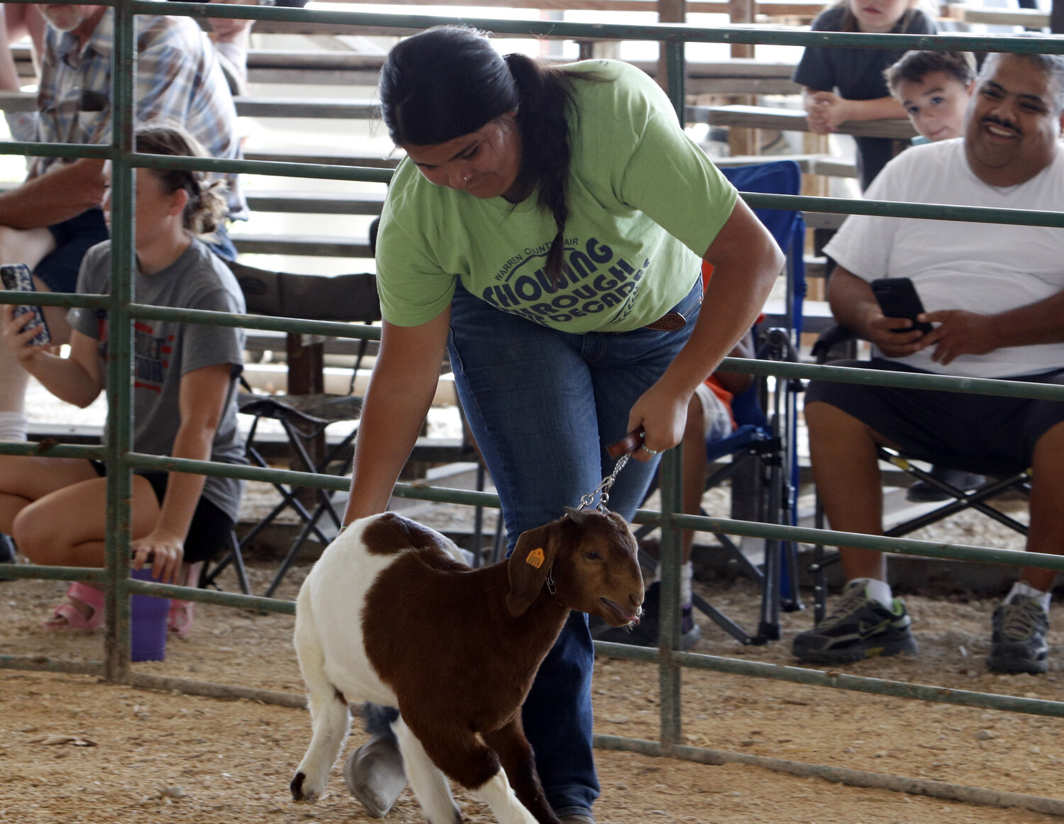 Kaylene Sosa leads her goat forward during the goat show at the Warren County Fair.