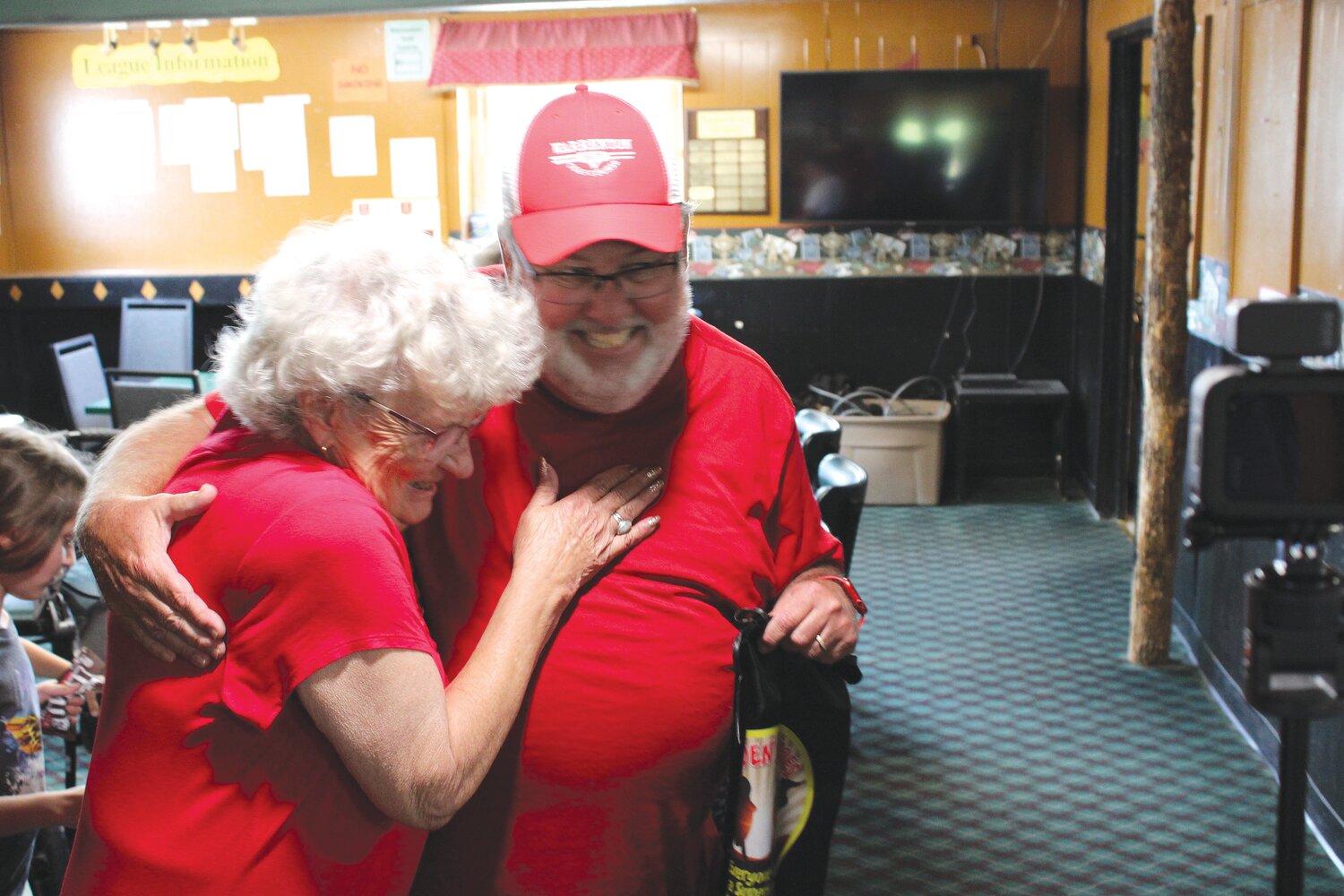 Hidden Hero Rich Barton gets a hug from Linda Staggs, the woman who made the nomination.