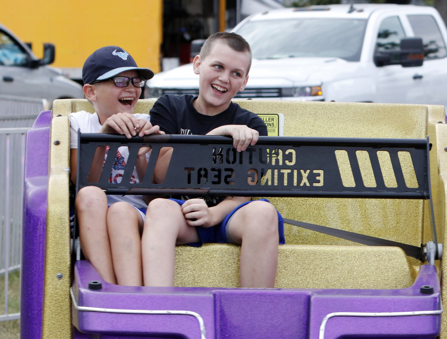 Two kids enjoy the Warren County Fair rides.