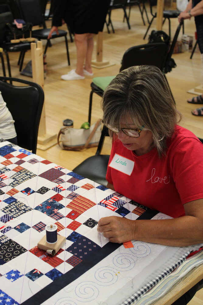A woman works on a quilt during the Quilts of Valor Eastern Missouri meeting July 12 in Warrenton.