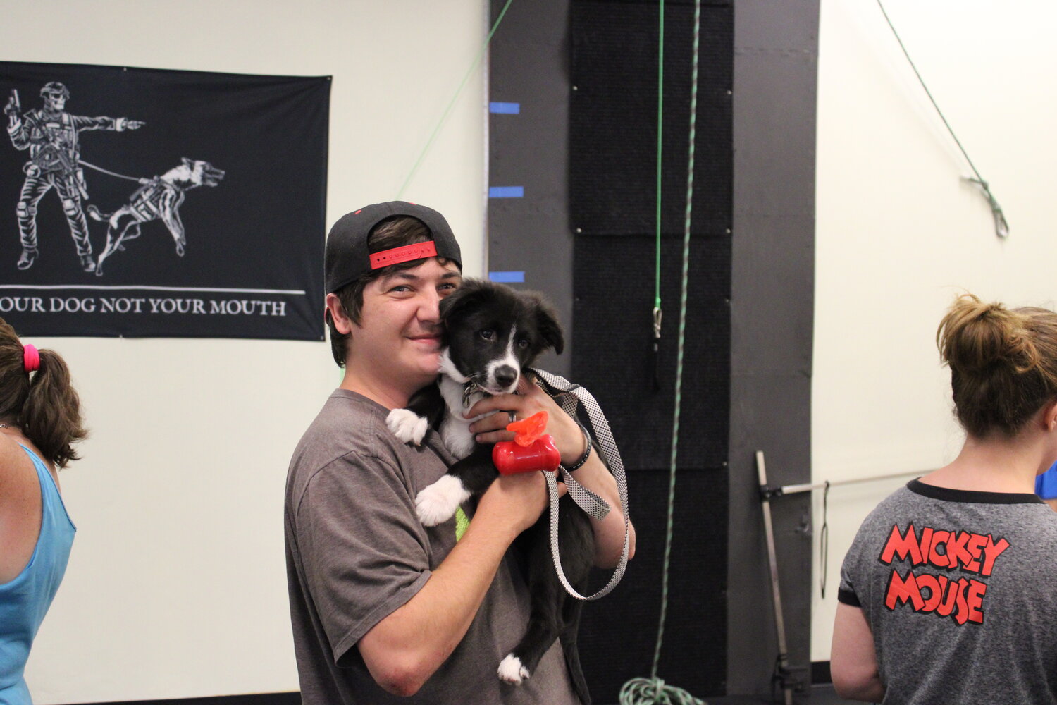 Devin Barton holds his dog, Ace, who was also getting a checkup from Dr. Jacob Lucas.