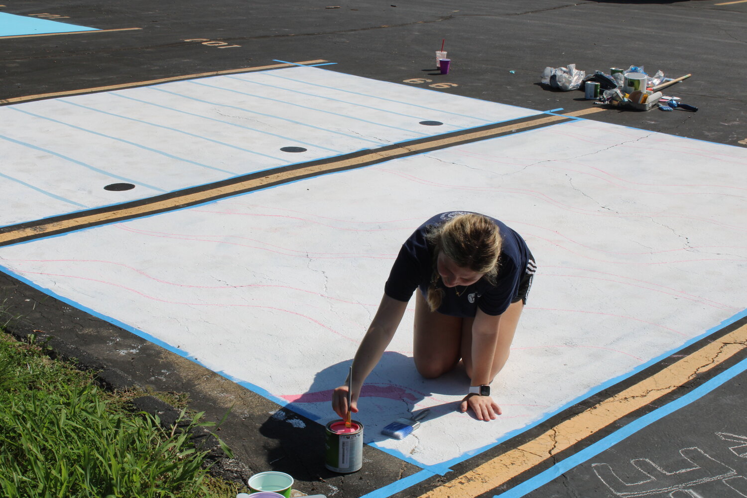 Senior Class President Tayla Payne works on her parking spot design.