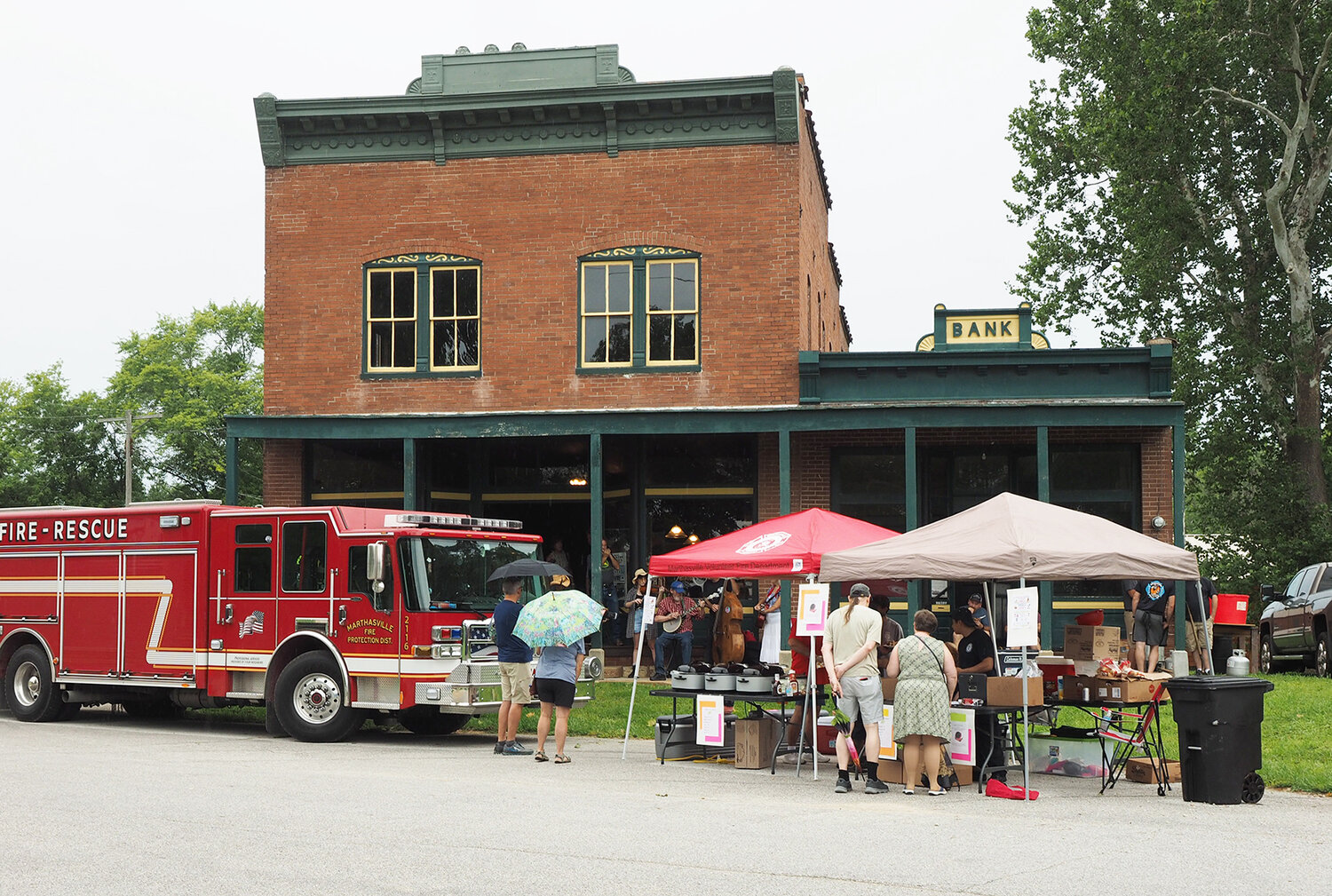 SWEET CORN FESTIVAL — Despite rain, sweet corn, brats and music were served up at the annual Sweet Corn Sunday near the historic Treloar Mercantile at the Katy Trail Sunday, Aug. 13. The event benefits the Marthasville Fire Protection District Auxiliary, whose focus is to provide new ventilation fans for the department. The event was sponsored by Magnificent Missouri.