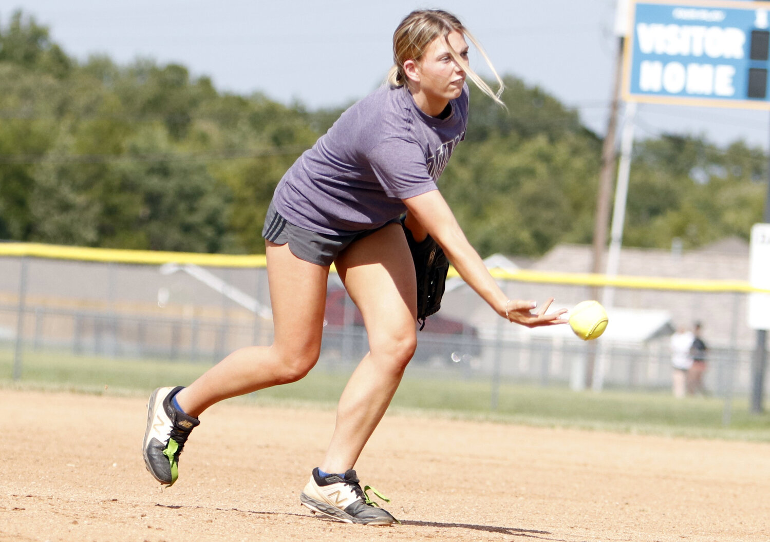 Tristyn Moore completes an underhand throw during an August practice.