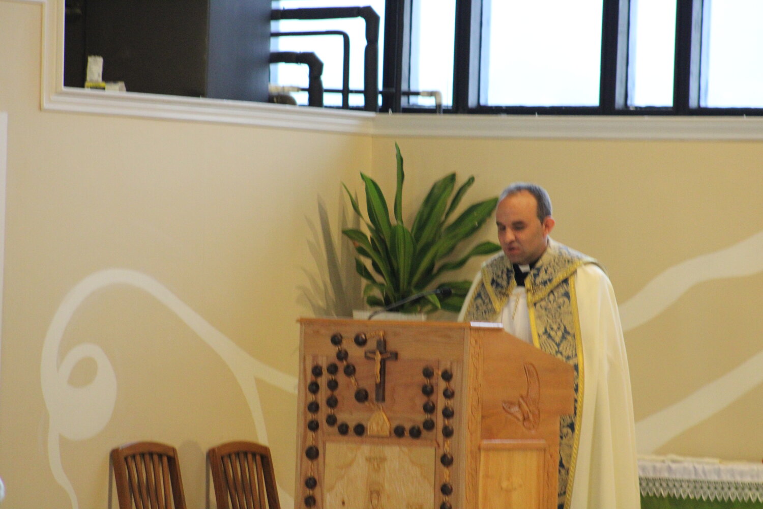 Father Eddie speaks at Holy Rosary.