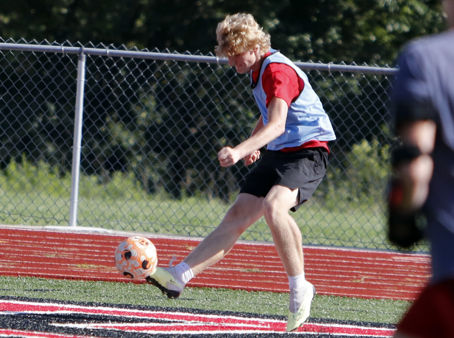 Isaac Wagner kicks the ball into the box during practice last week.