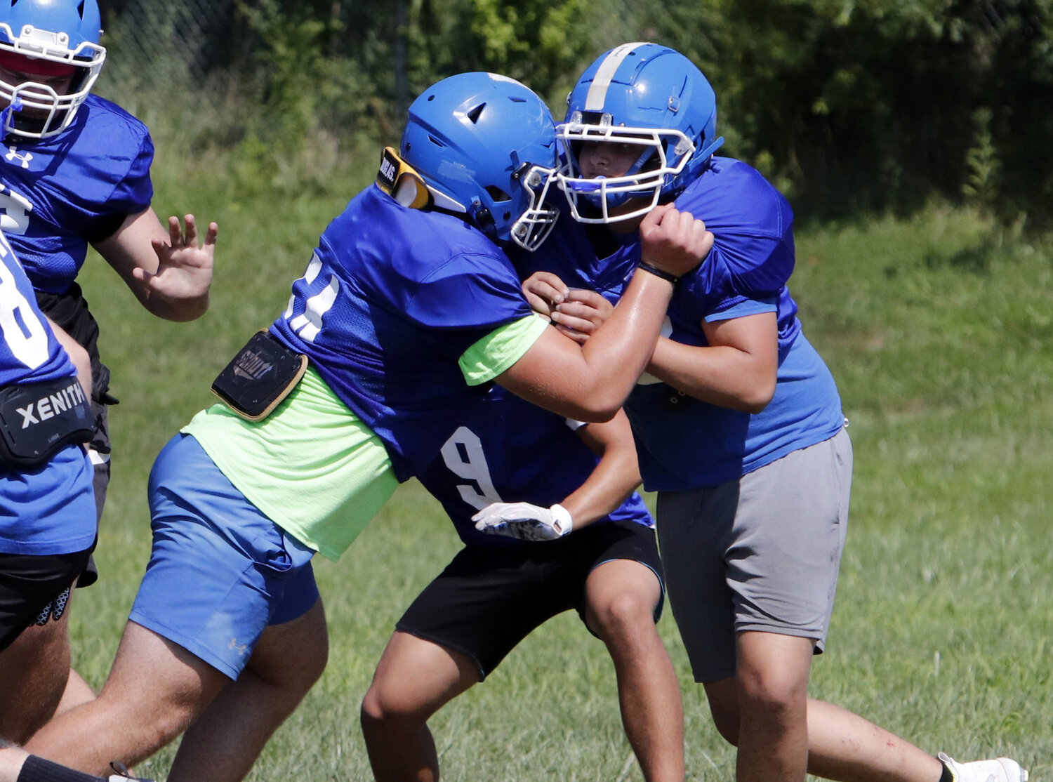 Wright City football players battle in the trenches during an August practice.