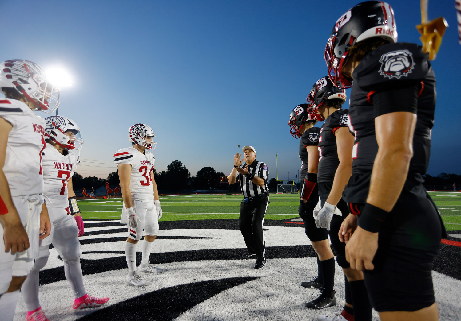 Warrenton and Fort Zumwalt South watch the coin toss before a game, Friday, Aug. 25, 2023, at Fort Zumwalt South High School in St. Peters, Mo.