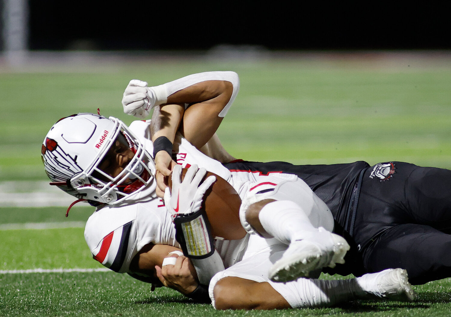Warrenton's Austin White (11) is brought down by Fort Zumwalt South, Friday, Aug. 25, 2023, at Fort Zumwalt South High School in St. Peters, Mo.
