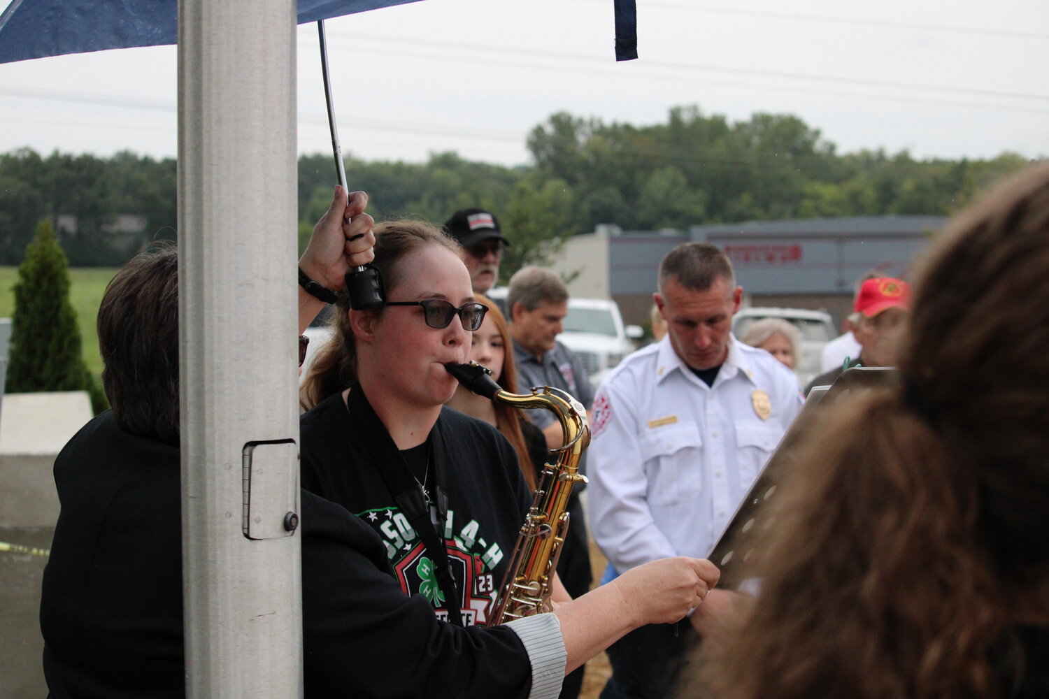 Doralynn Lee plays her saxophone during the Sept. 11 ceremony.