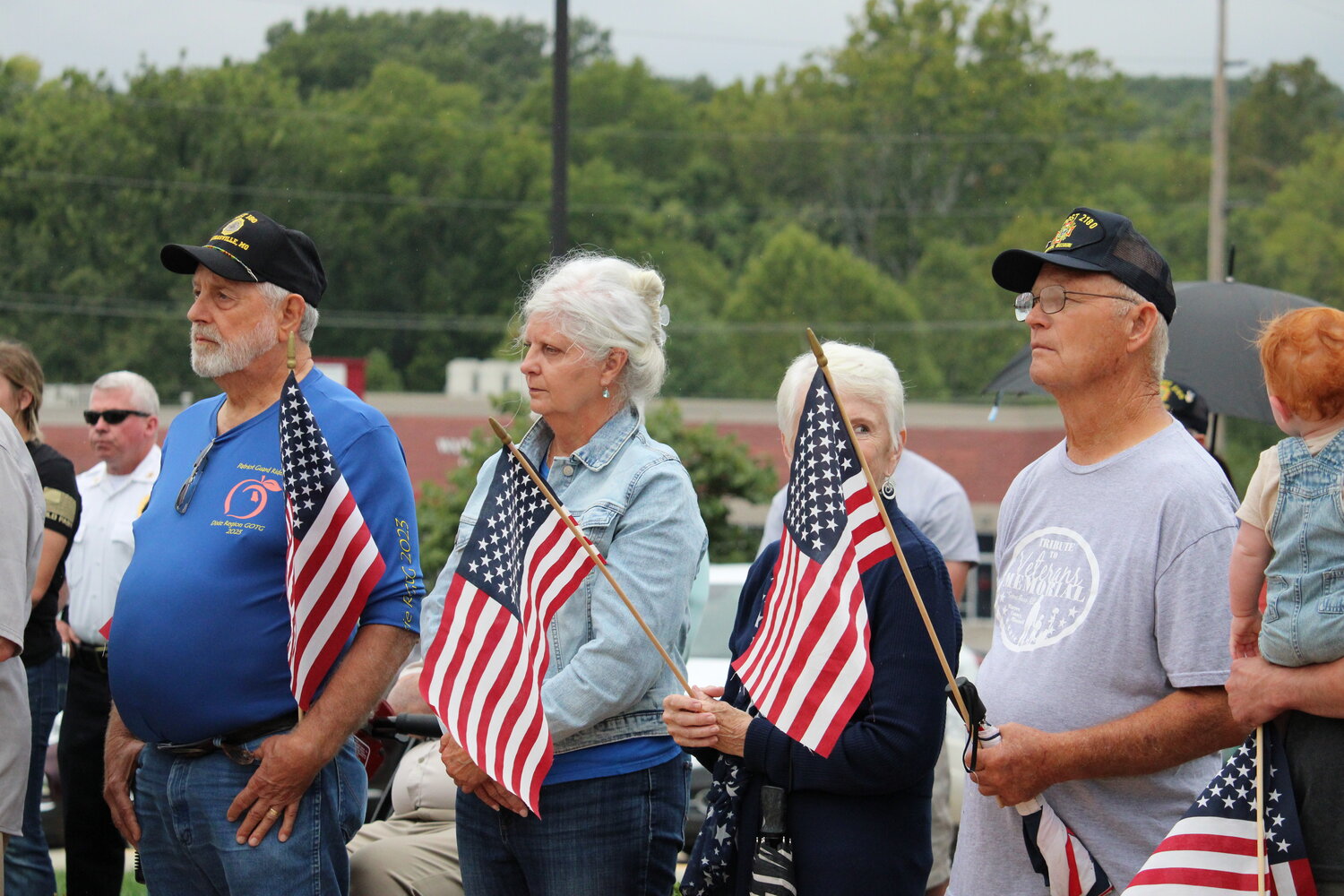 Several members of the crowd brought American flags with them to the ceremony.