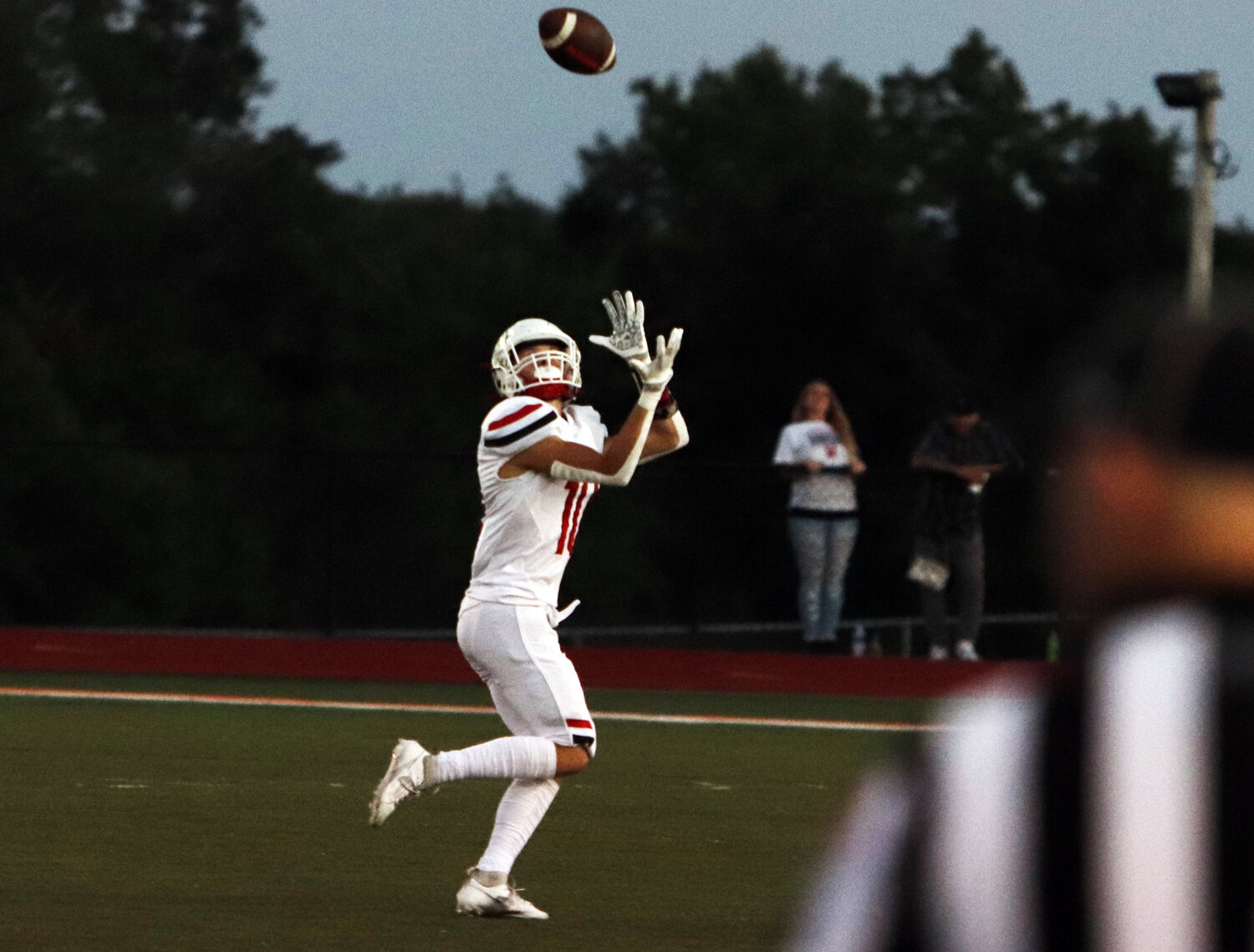 Mason Thompson hauls in a 75-yard touchdown pass during Warrenton’s win over Owensville.