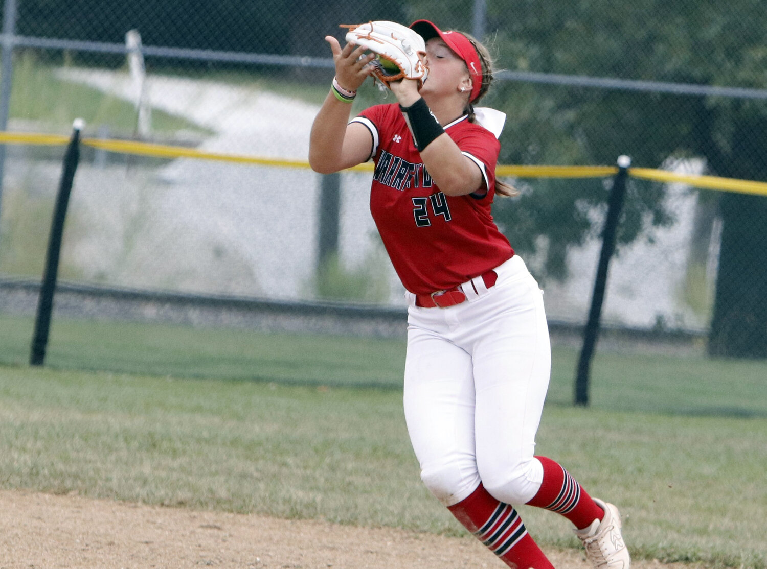 Makayla Witthaus catches a fly ball during Warrenton’s road game against St. Dominic.