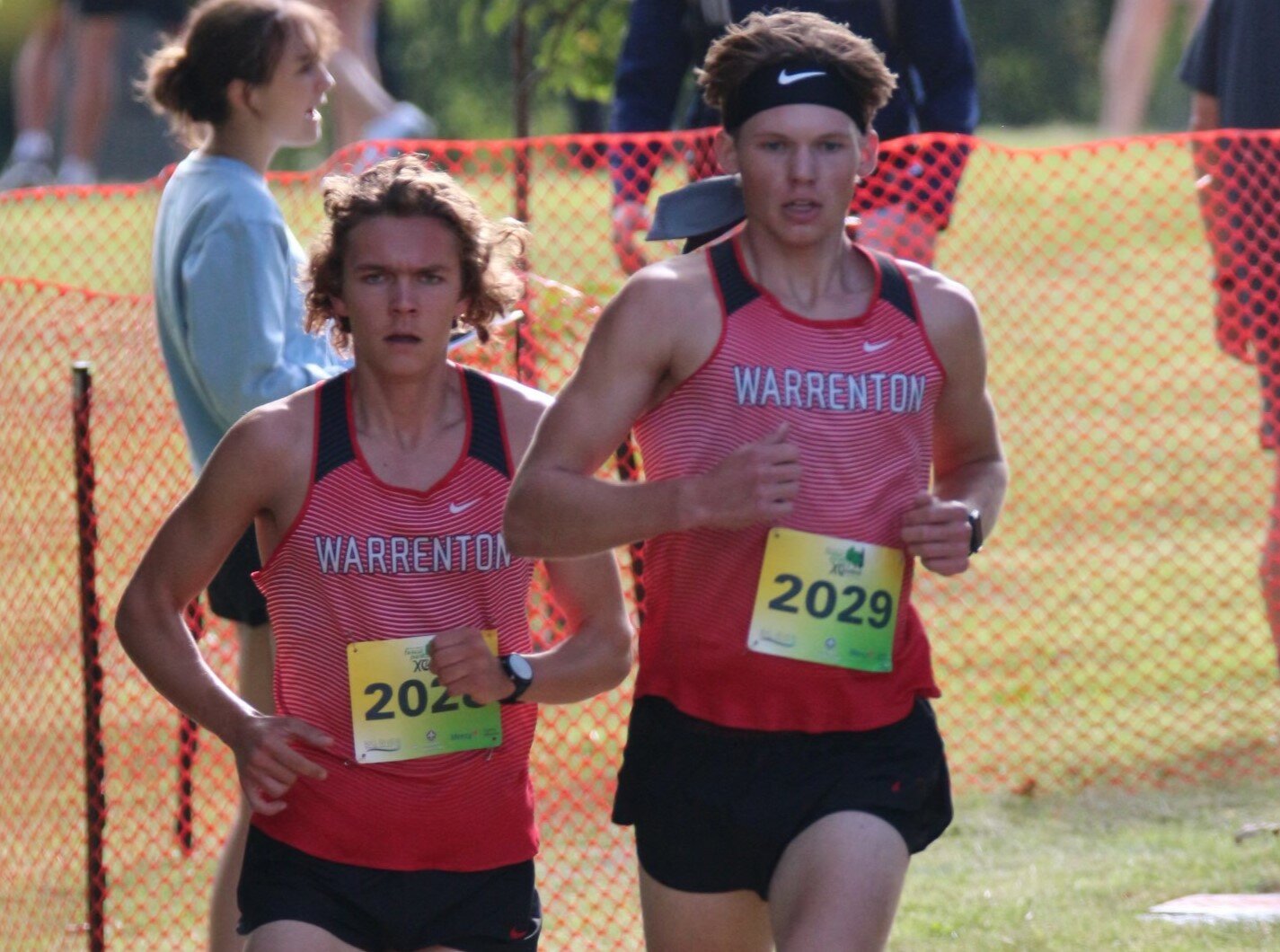 Warrenton’s Phillip Kackley (right) and Wyatt Claiborne lead runners at the Forest Park Invite. Kackley placed first and Claiborne placed third in the white division.