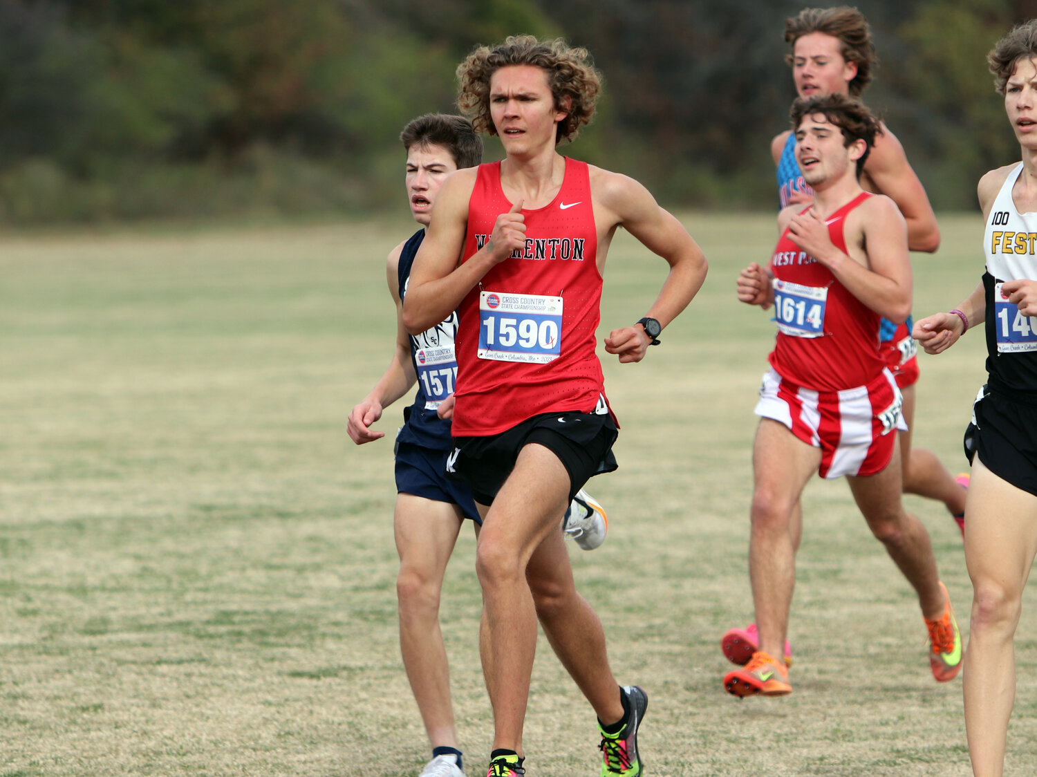 Warrenton senior Wyatt Claiborne leads a pack of runners during the Class 4 race.