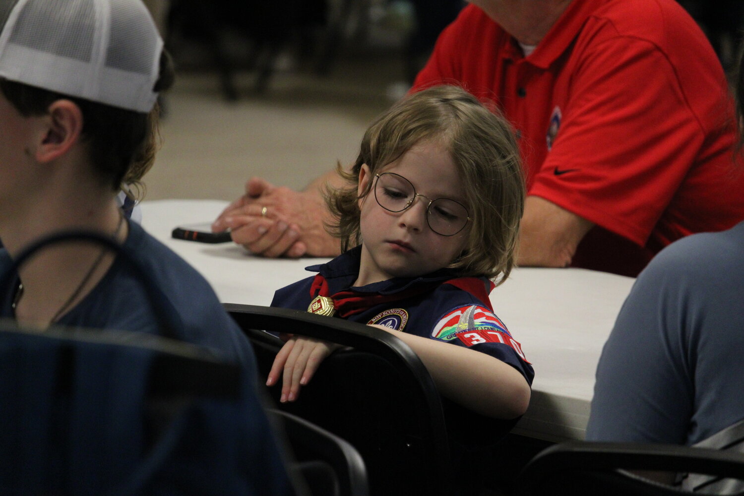 One of the Cub Scouts who helped lead the Pledge of Allegiance pays attention during the ceremony.