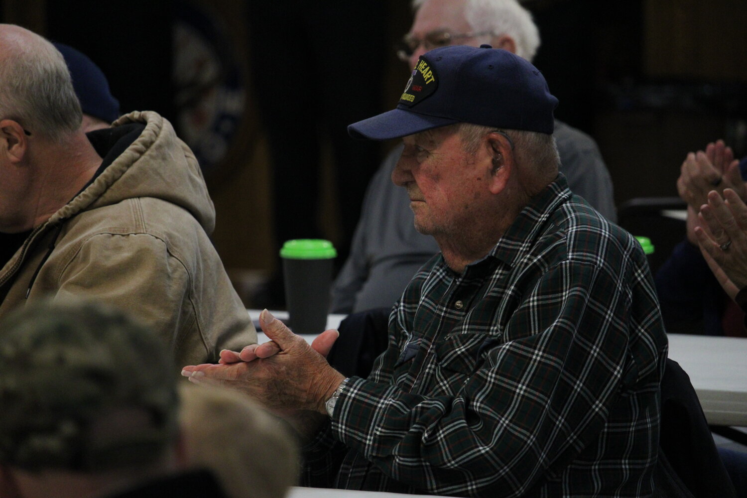A veteran listens during the ceremony.