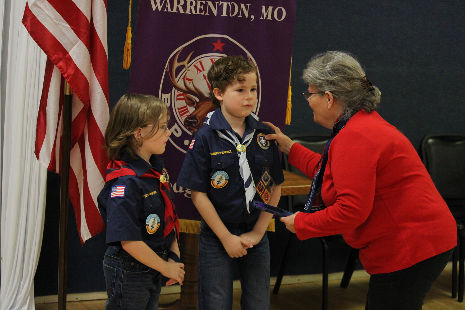 Cub Scouts gather at the end of the ceremony for a picture.
