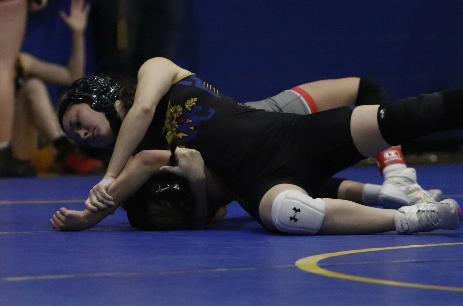 Wright City senior Samantha Yates pins Lilly Debo of Mexico to the mat during her final match of Saturday’s Wright City Tournament. Yates went 5-0 to win the 115-pound weight class.