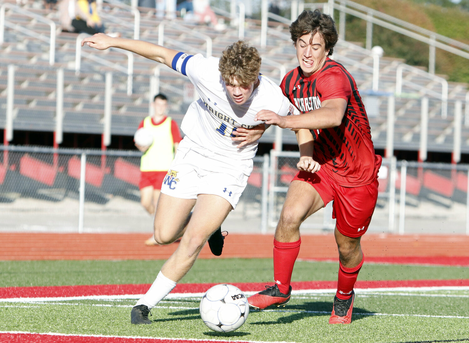 Nate Bowman attempts to move towards the goal during a regular season game against Warrenton.