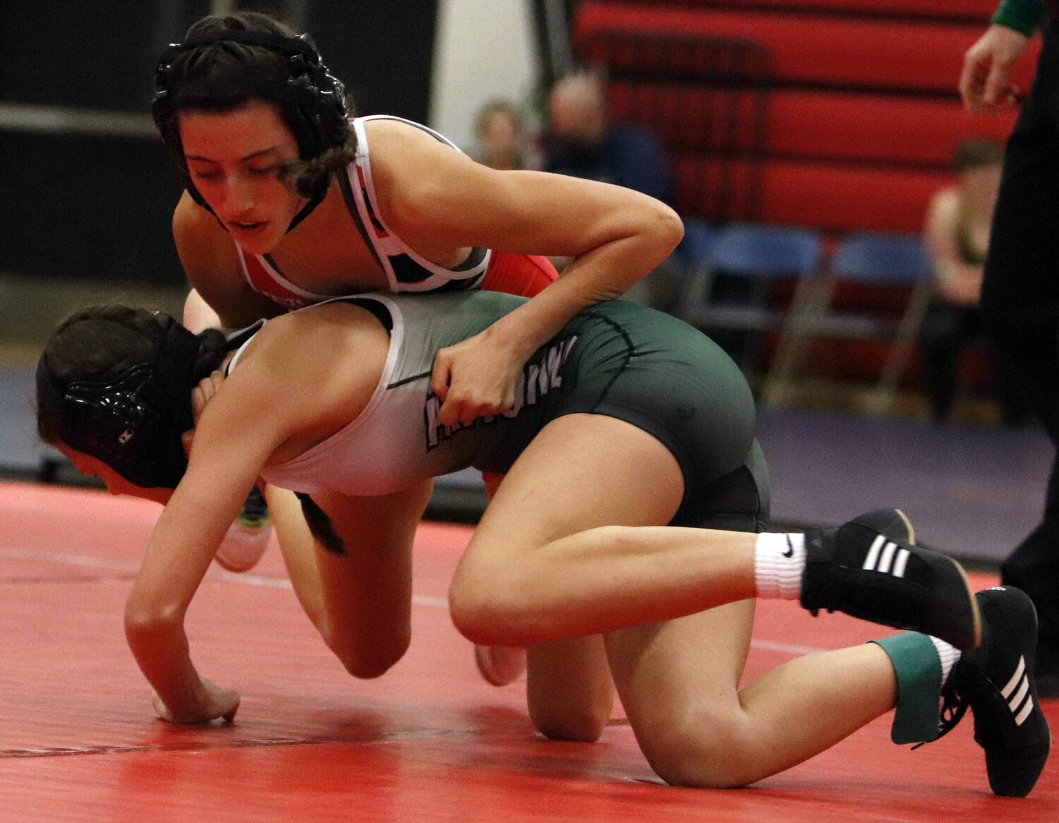 Alexis Ruff brings down Pattonville wrestler Taylor Skinner during the Liberty Invitational last week.