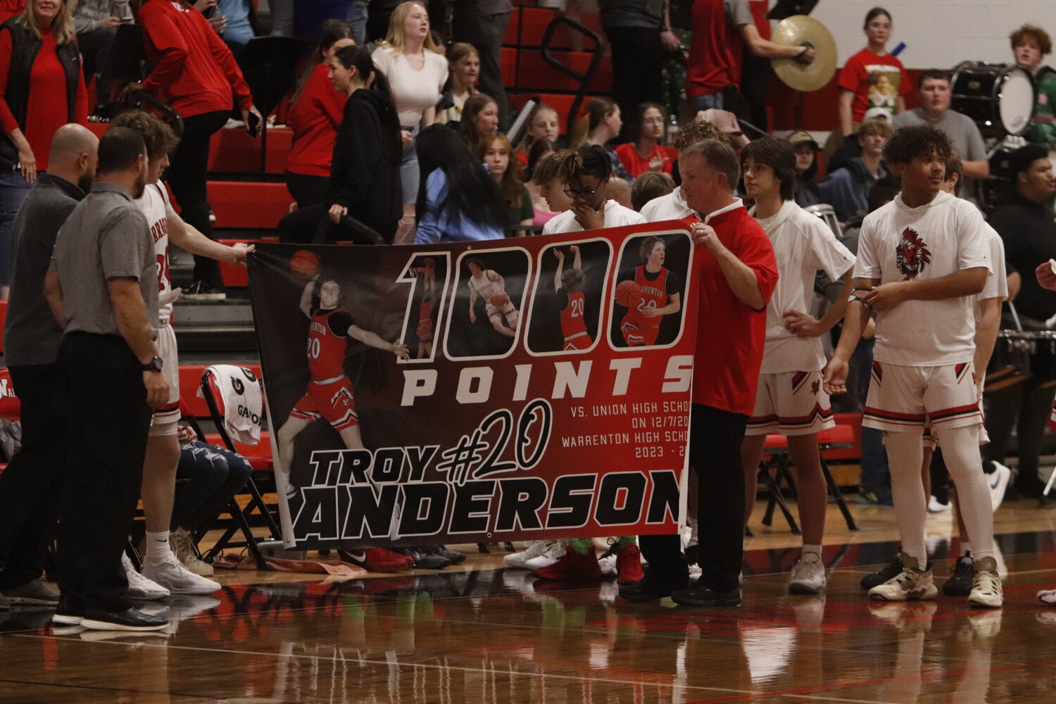 Warrenton senior Troy Anderson (third from left) was recognized before Warrenton’s home game Friday night for reaching 1,000 career points scored. Anderson reached the milestone Dec. 7 in a road game at Union High School.