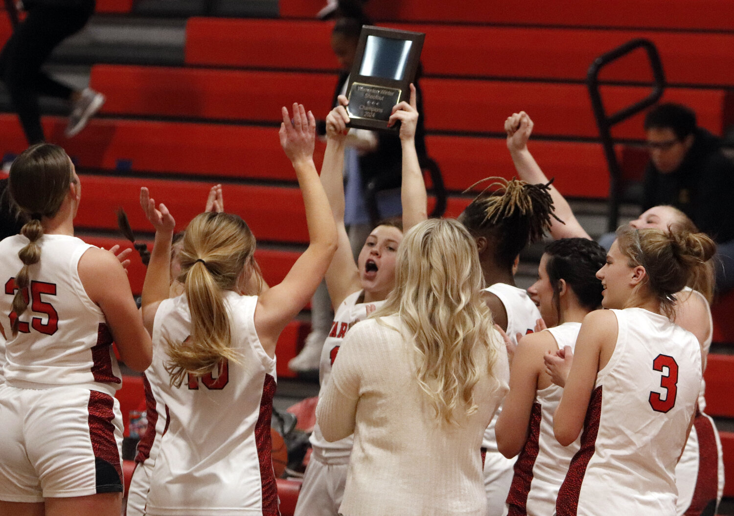 Warrenton celebrates after receiving the first place plaque after winning the Warrenton Winter Classic last week.