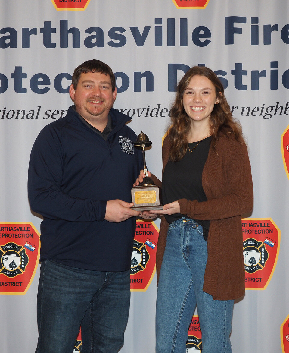 Awards committee member Charlie Eichmeyer, left, presented the Rookie of the Year Award to Medical Officer Morgan Gratza during the annual banquet held Saturday, Jan. 20. Gratza, firefighter and EMT, serves as a CPR and Stop the Bleed instructor and is the School Resource Officer for St. Ignatius Catholic School. She was voted Rookie of the Year by fellow firefighters at the Marthasville Fire Protection District.
