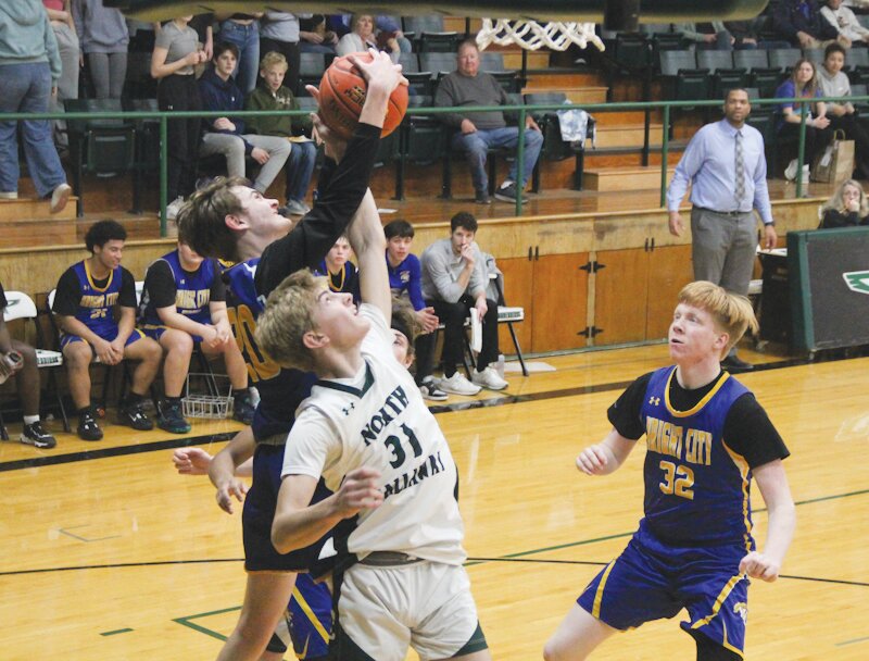 Chris Kornfeld battles for a rebound during the game with North Callaway.