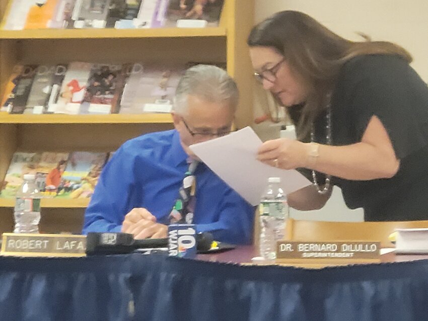TAKING A STAND: School Committee Chairman Robert LaFazia and member Susan Mansolillo confer during one of last year's charged meetings.