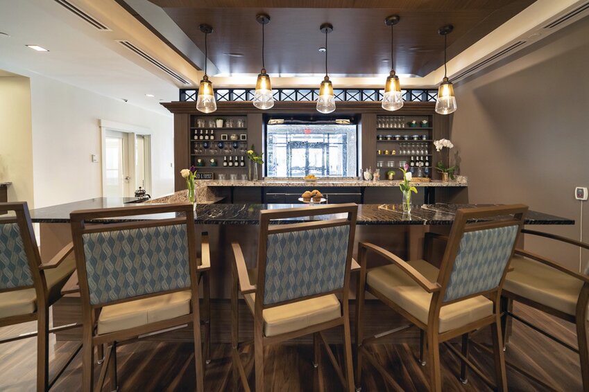 When you visit The Preserve at Briarcliffe, you will see common gathering spots just like this cozy “Cheers-style” bistro where frequent resident socials are held. All areas invite residents to linger, converse, reminisce and connect.