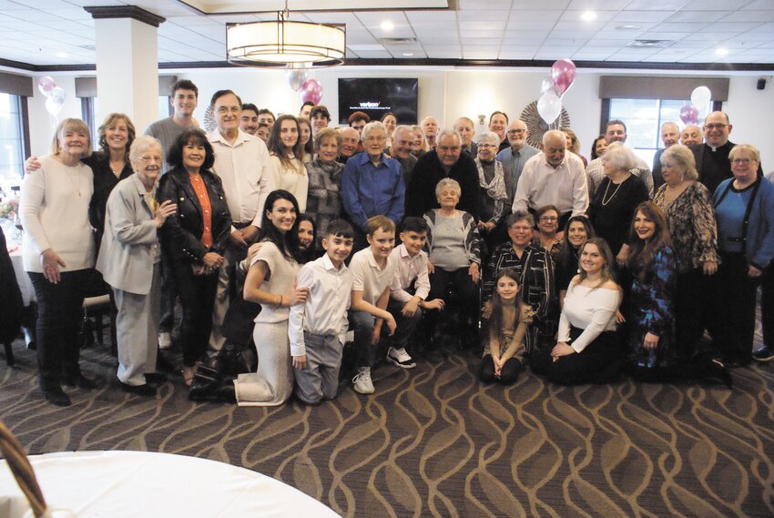THE WHOLE PARTY: Everyone in attendance, including Notarianni’s sizeable family, all stand together for a photo.