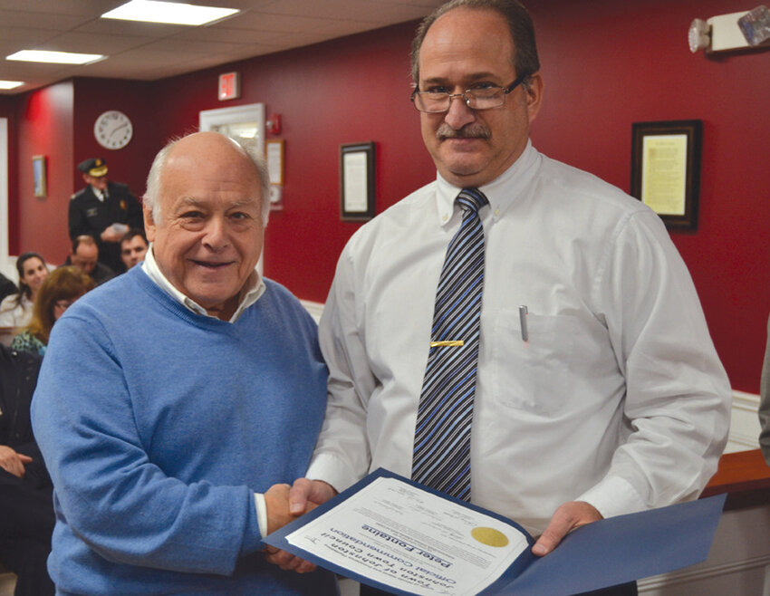 CONGRATULATIONS PETE: In this 2017 file photo, Pete Fontaine was presented with a special commendation by Town Councilman Robert Civetti. He was recognized for doing a “great job for the Town of Johnston and the athletes of the town at all levels,” he was honored for his coverage of events of all kinds. That same year, Fontaine was inducted into the Johnston High School Hall of Fame.
