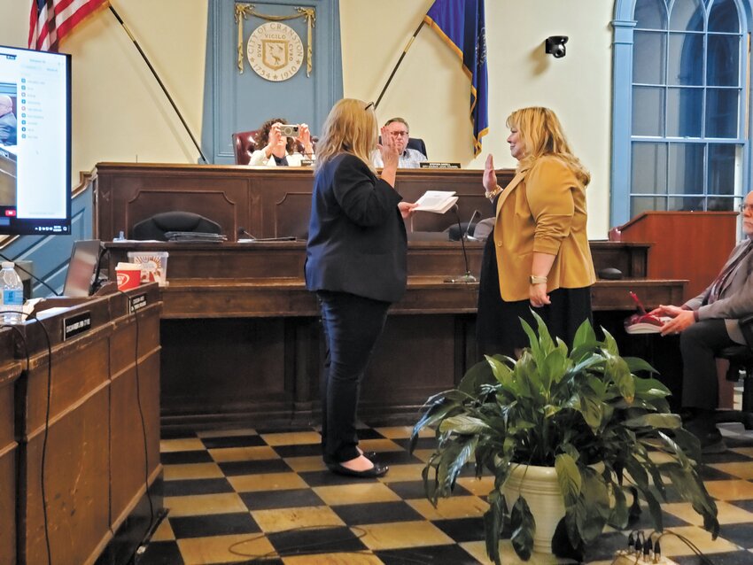 SO HELP ME GOD: Kristen Haroian takes the oath of office as Ward 2’s new City Councilwoman, following the resignation of former City Councilwoman Aniece Germain. (Photo by Kevin Fitzpatrick)