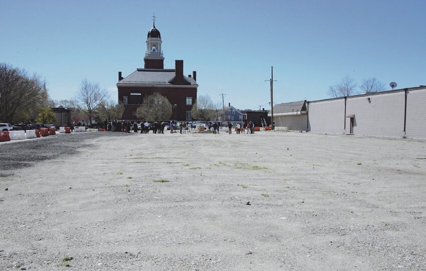 View of the dirt and gravel lot: Once the site of a City Hall annex building -- that will be transformed into a community plaza that will feature an ice rink in the winter.  It is being sponsored by the Greenwood Credit Union.