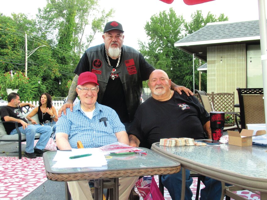 LAST YEAR’S RUN: Goodfellas Motorcycle Club President Derek Duffy stood behind the club’s philanthropic donor Bruno Ramieri and organizer Cal Calabro during registration for the group’s 7th annual run.