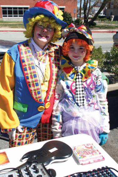 CLOWNING AROUND: Jolly Joyful and Jell-E-Bean the clowns (played by Rachael Noon and Penny Stanley) take time out of some serious clowning around to pose for a photo together at Saturday's Lemonade Stand to benefit the MS Society.