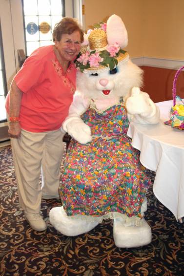 Thanks Easter Bunny!: Lolly Grello, a resident of The Seasons, and former Cranston resident, says hello to Mrs. Bunny during the annual Family Easter Egg Hunt at The Seasons in East Greenwich.