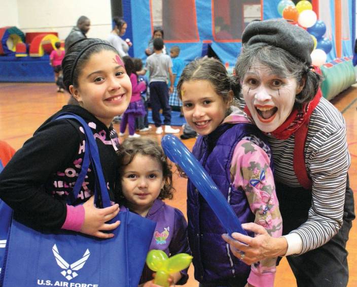 MIME TIME: Pictured with Amy the Mime (Amy Beth Parravano of Cranston) is Cassidy Marcano, age 10, Analese Marcano, age 4 and Kiara Medeiros, age 8.