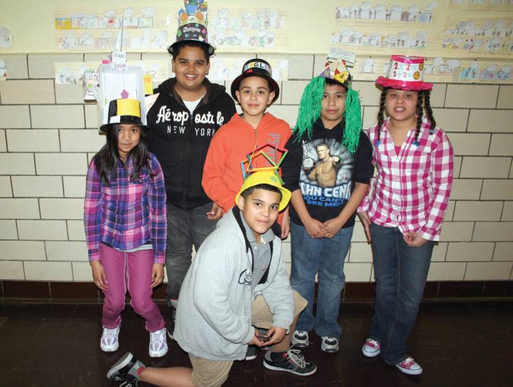 ALL SHAPES AND SIZES: A group of fifth grade students at Gladstone gather to show all of the different mathematical vocabulary used during this year's hat parade. From left are Nathalia Lasala, Elthon Fernandez, Joshua Montufar, Kendrick Natareno-Tinoco and Nicole Espinal. Pictured at the bottom front is Sebastian Vidal.