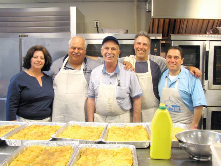 IN THE KITCHEN: The Greek Food Fest, held on April 28 and 29, attracted a record crowd inside the Mihailidies Center-Demetrekas Hall. There were long lines of hungry patrons and volunteer super staffers. A key to the event&rsquo;s success was the group of dedicated volunteers, including volunteer chefs, from left, Liz DeGaitas, Theofanis Markos, Harry Bablenis, Gabriel Daiaa and Dennis Sampalis.