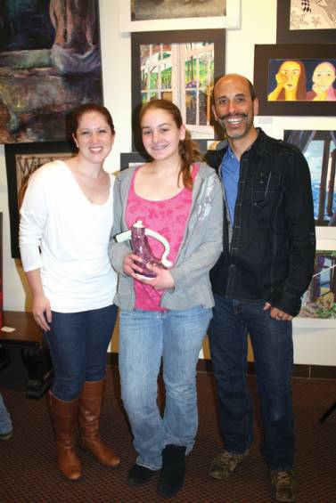 PARTNERS IN ART EDUCATION: Nicole Eaton, a seventh grader at Park View Middle School, stands with Alicia Hawkins and Paul Carpentier, two of the art educators in Cranston Public Schools&rsquo; art program.