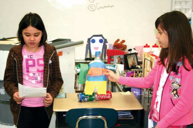 A LITTLE HELP: Although Melanie Trindade created the &quot;Recycleable Doll,&quot; which boasts &quot;all eco-safe materials,&quot; she had her classmate Sabrina Young read her piece aloud, due to a touch of laryngitis.