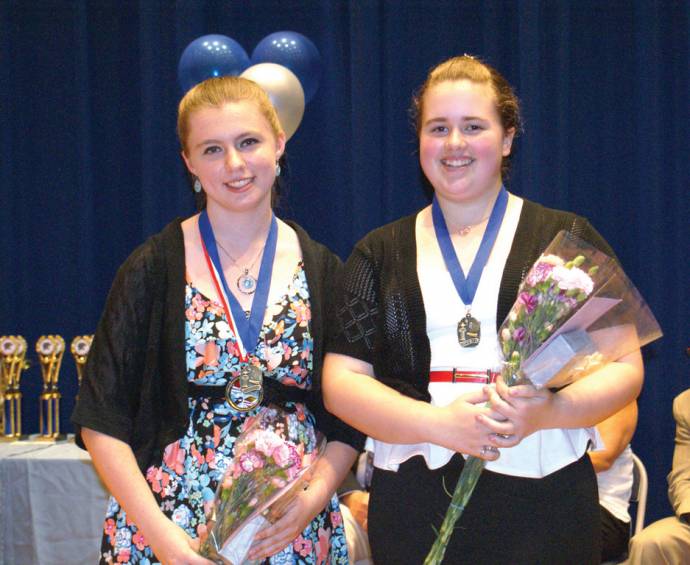 The Nicholas A. Ferri Middle School hosted their Awards Night last Wednesday, June 13, at the Johnston High School auditorium. Pictured here, Jenna Bouchard and Madison Follett receive the &ldquo;Team 8 Blue&rdquo; Student of the Year Awards.
