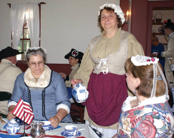 STRAWBERRIES AND TEA: Serving tea and strawberry biscuits at the Joy Homestead in honor of &ldquo;March to Victory&rdquo; is Lydia Rapoza from the Cranston Historical Society, along with Priscilla Borden and Phyllis Swirka. This month, Joy Homestead celebrated the March to Victory on the Washington Rochambeau Revolutionary Route, a National Park Heritage Trail. From June 18 to 21 in 1781, more than 4,000 French soldiers commanded by General Rochambeau marched on Cranston Street, Phenix Avenue and Scituate Avenue in Cranston. They didn't know it then but they were marching to defeat the British at the final major battle of the War of Independence in Yorktown, Va