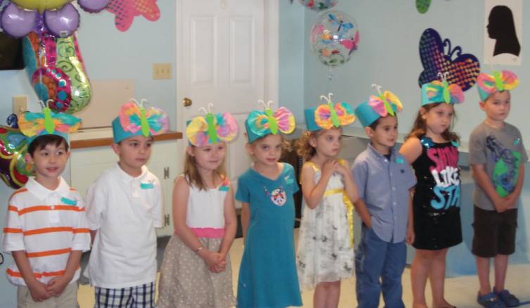 Students perform for parents, families and friends at the Cherry Hill Pre-School graduation, wearing the butterfly hats and caterpillar pins they made for the event. The center had morning and afternoon graduation ceremonies, with a theme of &ldquo;Butterflies, ready to fly.&rdquo;