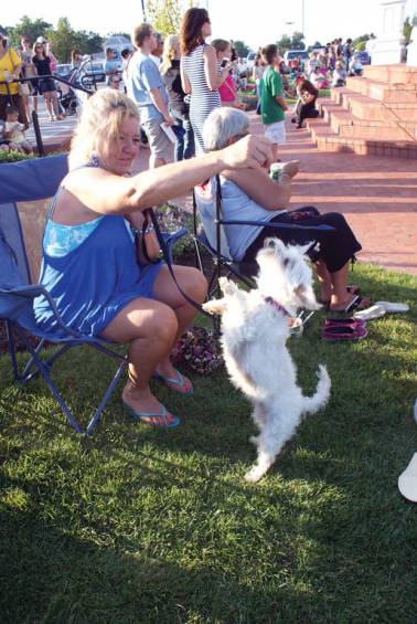 HIP HOP PUP: Debbie Spagnoli of Cranston enjoys the show with her 5-year-old West Highland Terrier, Myley.