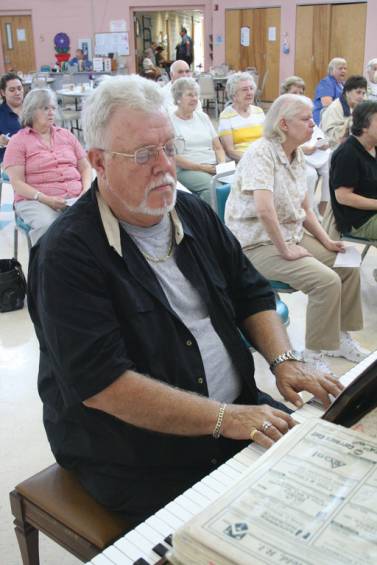 ON THE KEYBOARD: Phillip Brown plays accompaniment for Gerry Butterfield.